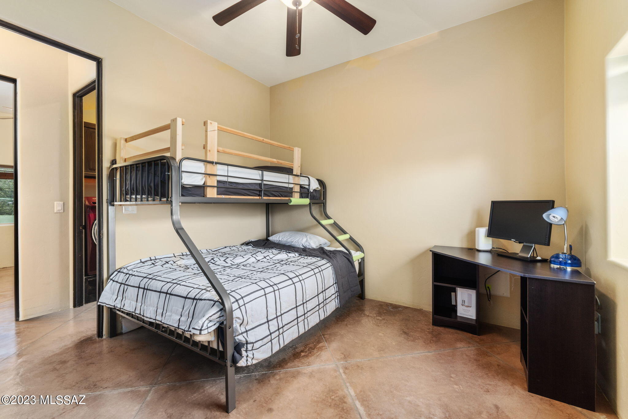 5670 Triangle X Place Tucson, AZ 85713 - Photo 18 of 36 a bedroom with a bed and a desk