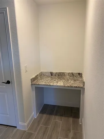 a view hallway with granite countertop