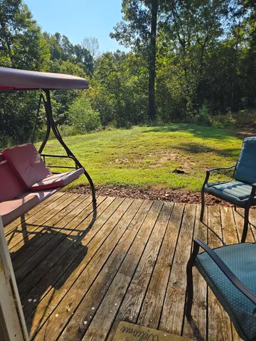 a view of swimming pool with chairs