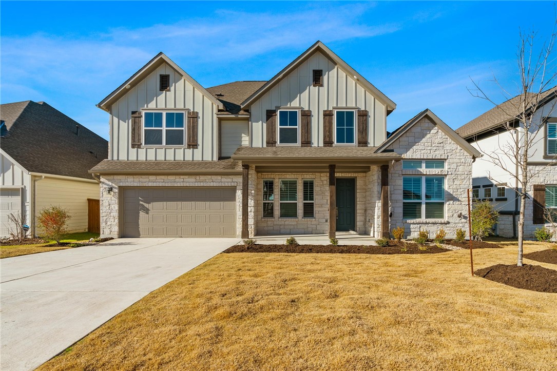 1607 Hazy Hills Loop Dripping Springs, TX 78620 - Photo 1 of 1 a front view of a house with a yard