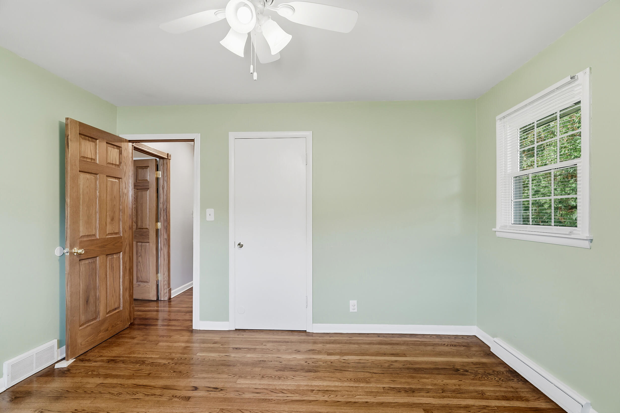 10710 Porter Street Crown Point, IN 46307 - Photo 40 of 65 a view of an empty room with wooden floor and a window