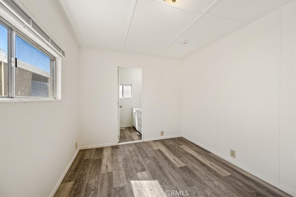 3210 Santa Maria Way, Unit 49 Santa Maria, CA 93455 - Photo 19 of 50 a view of empty room with wooden floor