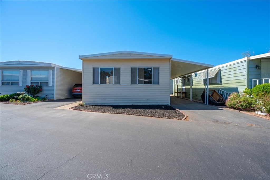 3210 Santa Maria Way, Unit 49 Santa Maria, CA 93455 - Photo 2 of 50 a front view of a house with a yard