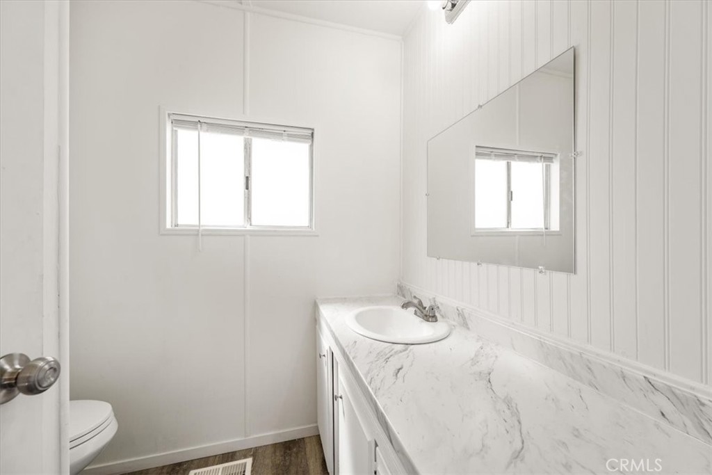 3210 Santa Maria Way, Unit 49 Santa Maria, CA 93455 - Photo 21 of 50 a bathroom with a sink toilet and vanity