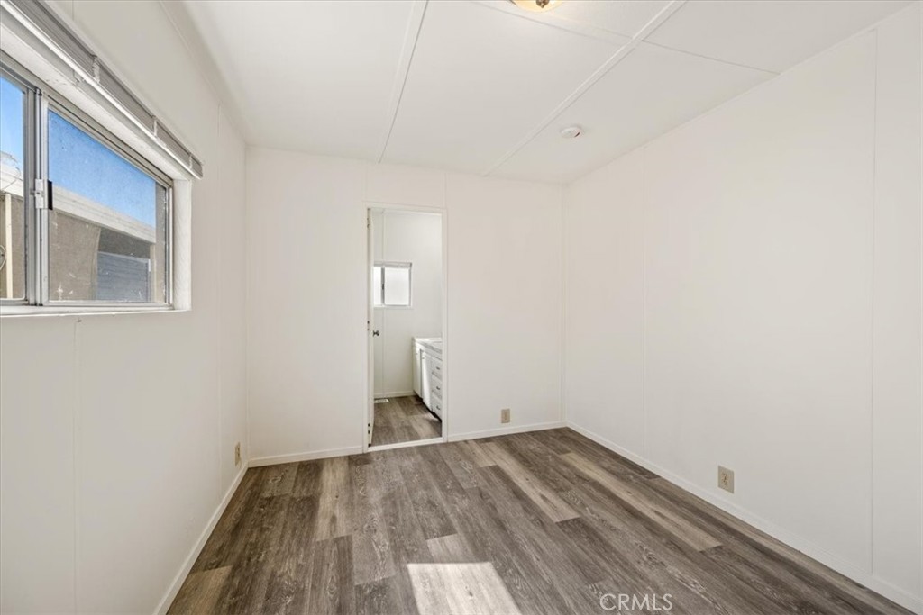 3210 Santa Maria Way, Unit 49 Santa Maria, CA 93455 - Photo 28 of 50 a view of empty room with wooden floor
