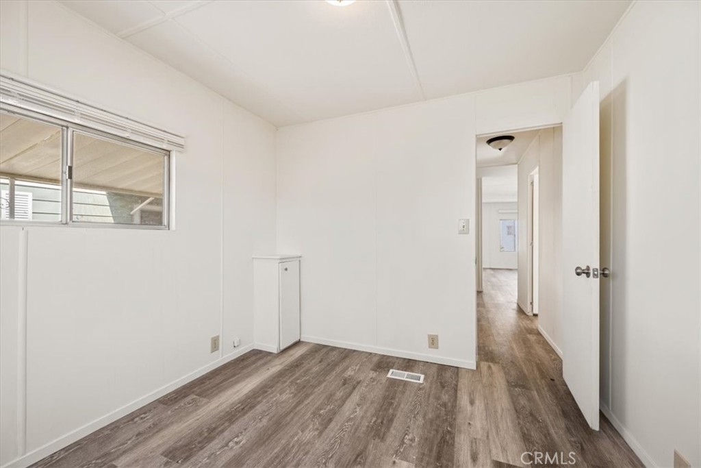 3210 Santa Maria Way, Unit 49 Santa Maria, CA 93455 - Photo 30 of 50 a view of a room with wooden floor and windows