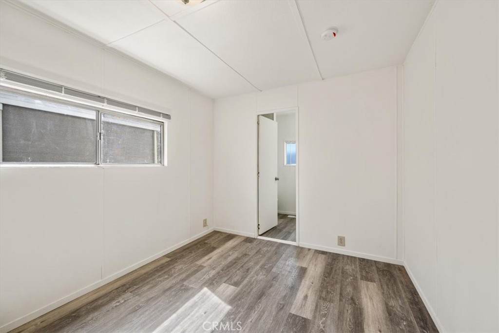 3210 Santa Maria Way, Unit 49 Santa Maria, CA 93455 - Photo 41 of 50 a view of empty room with wooden floor and fan