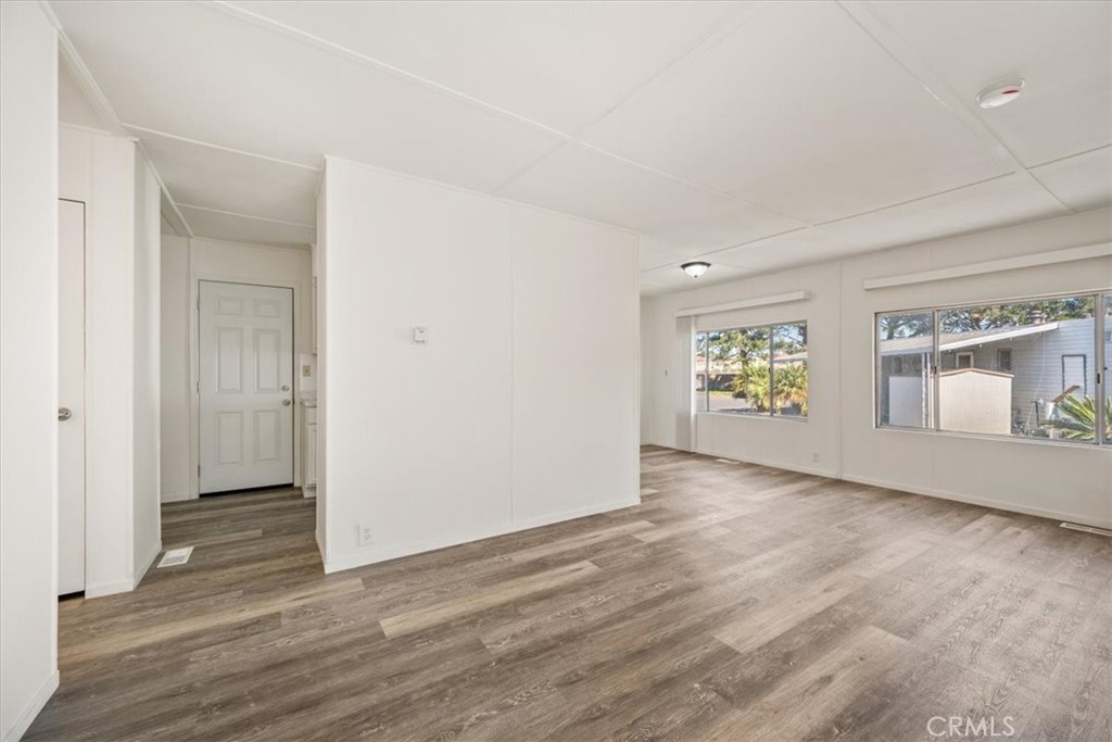 3210 Santa Maria Way, Unit 49 Santa Maria, CA 93455 - Photo 42 of 50 an empty room with window and wooden floor
