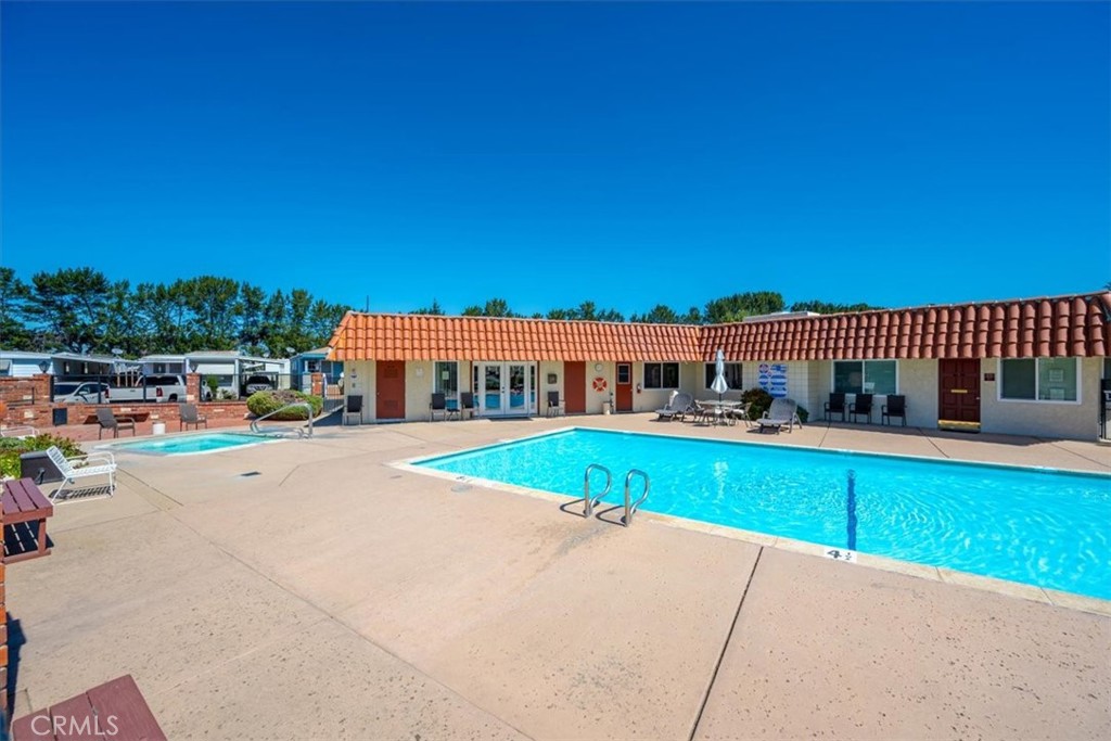 3210 Santa Maria Way, Unit 49 Santa Maria, CA 93455 - Photo 49 of 50 a view of a house with a swimming pool
