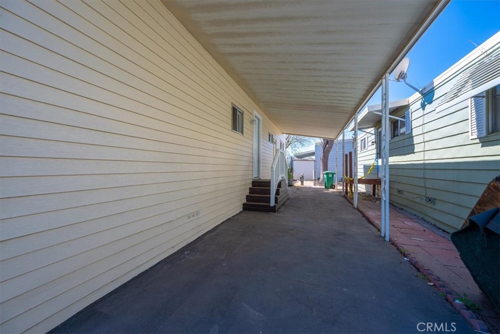 3210 Santa Maria Way, Unit 49 Santa Maria, CA 93455 - Photo 9 of 50 a view of a patio with table and chairs