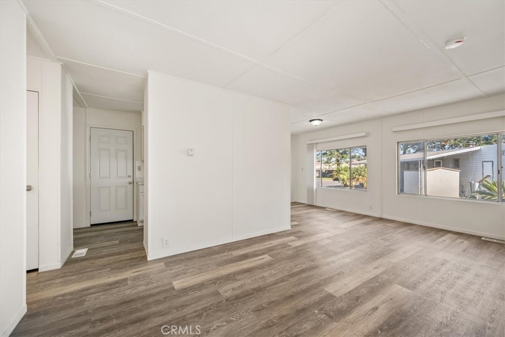3210 Santa Maria Way, Unit 49 Santa Maria, CA 93455 - Photo 10 of 50 an empty room with window and wooden floor