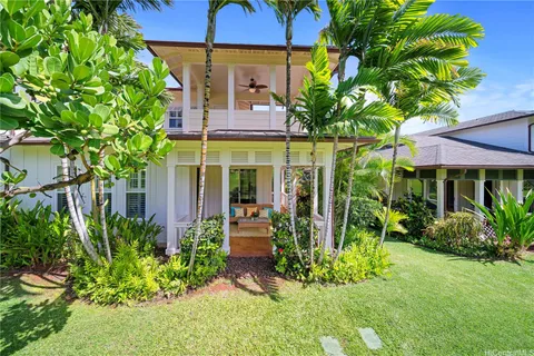 a view of a house with potted plants