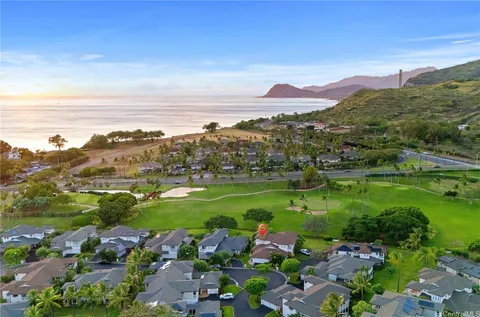 a view of a city with mountains in the background
