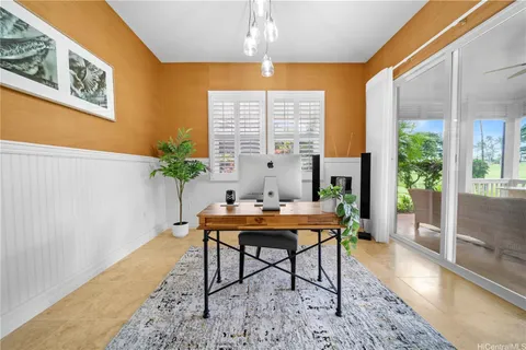 a workspace with furniture and a potted plant