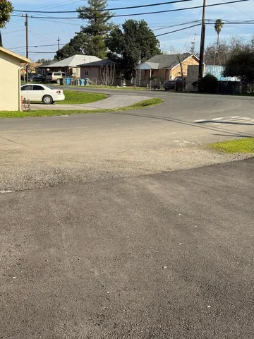 a view of a yard and front view of a house