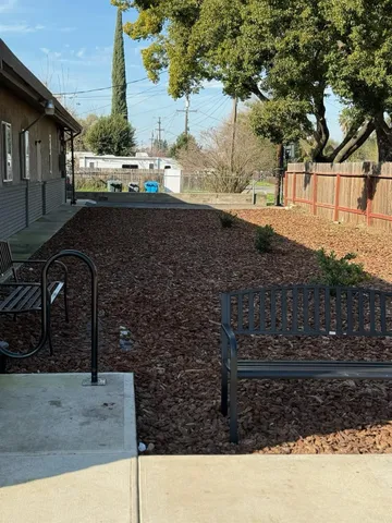 a view of a hallway with wooden floor and entryway