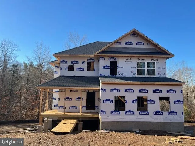 a front view of a house with windows and a yard