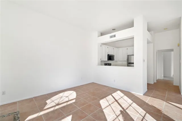 a bedroom with a bed and a mirror