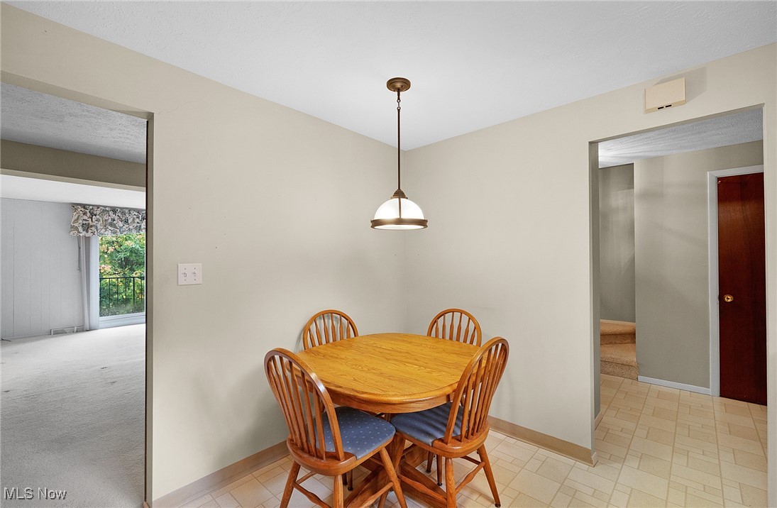 6474 State Road, Unit I10 Parma, OH 44134 - Photo 7 of 31 Dining space with baseboards and light colored carpet