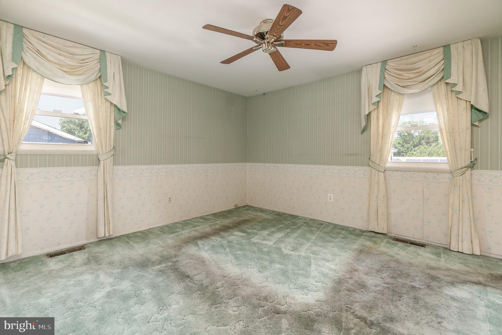 1908 Juniper Road Edgewood, MD 21040 - Photo 19 of 37 an empty room with windows and fan