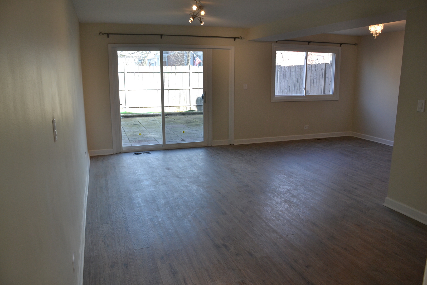 739 Hibbard Road Wilmette, IL 60091 - Photo 5 of 17 an empty room with wooden floor and windows