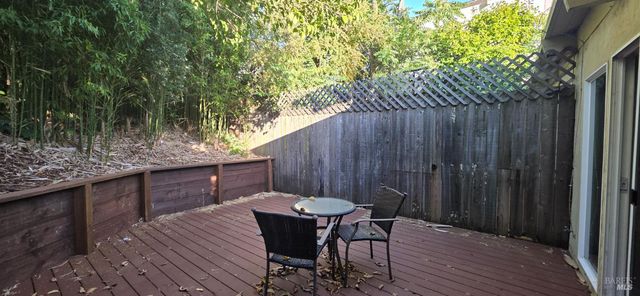 a view of a table and chairs in the balcony
