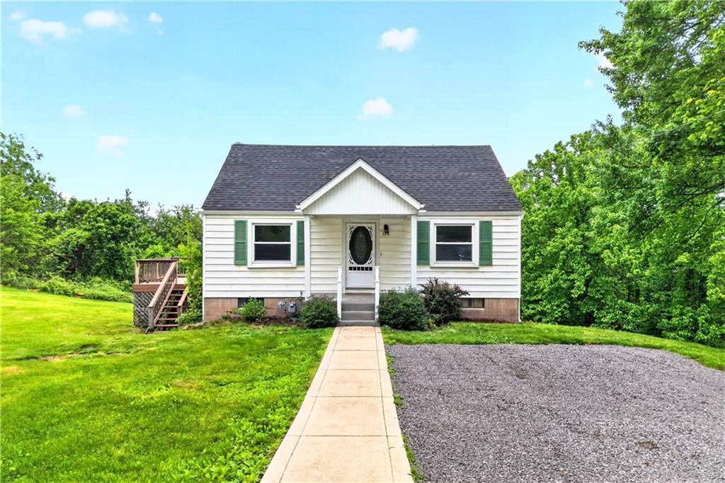 124 Bunker Hill Road Aliquippa, PA 15001 - Photo 1 of 37 a front view of house with yard and green space