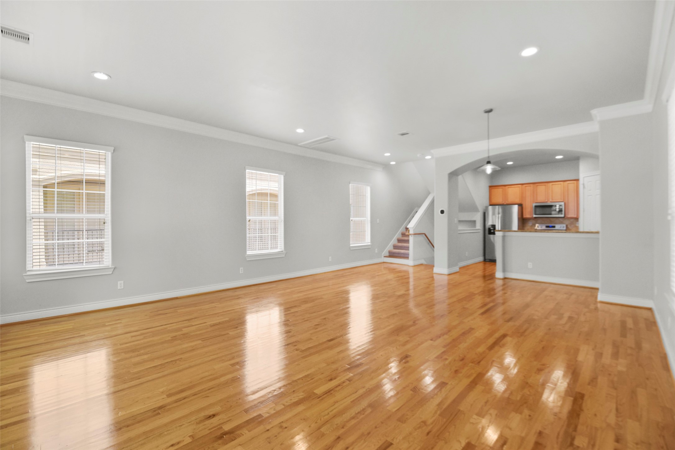 1602 Colorado Street Houston, TX 77007 - Photo 4 of 29 a view of empty room with wooden floor and a window