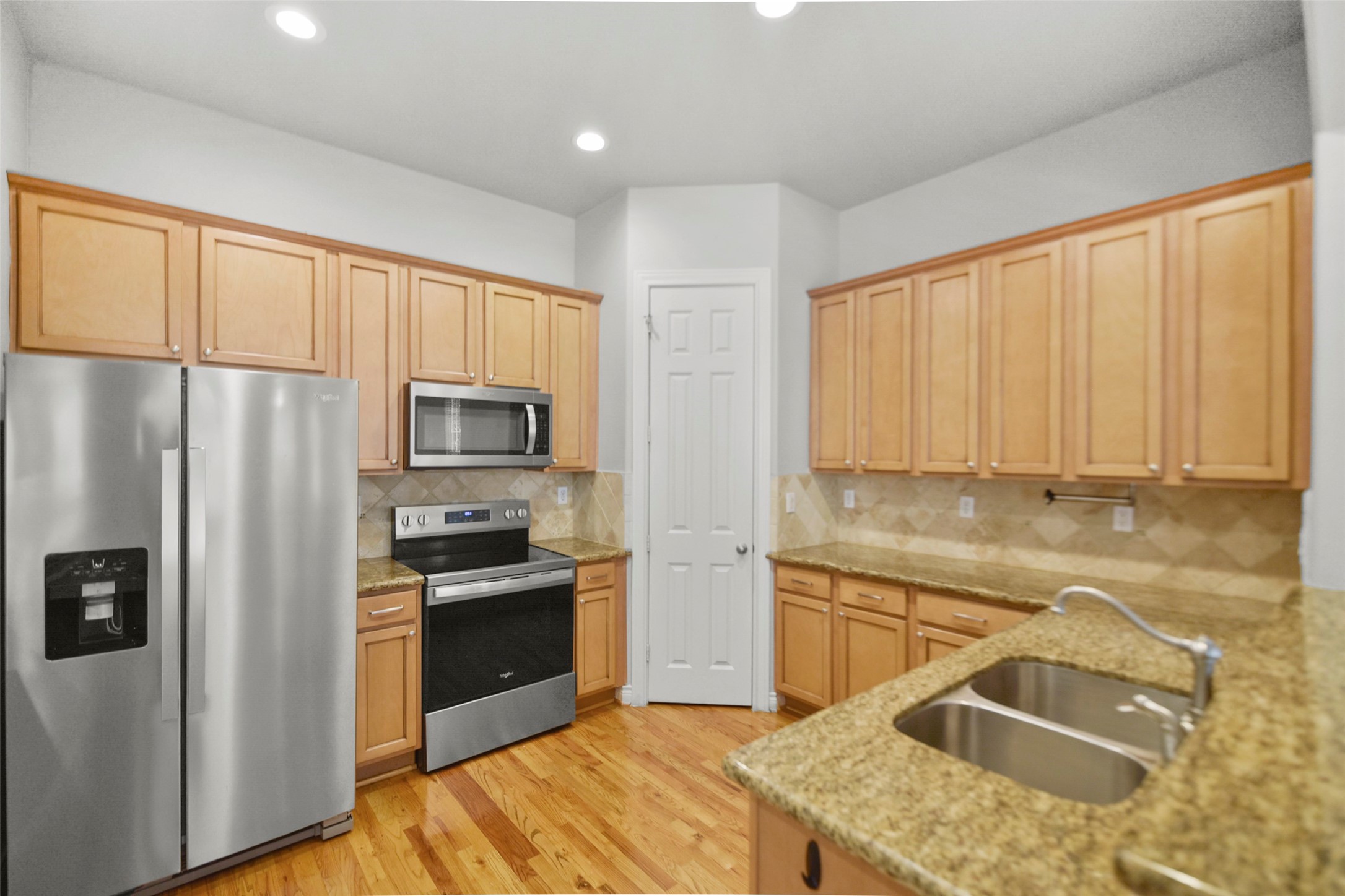 1602 Colorado Street Houston, TX 77007 - Photo 6 of 29 a kitchen with granite countertop a sink stainless steel appliances and cabinets