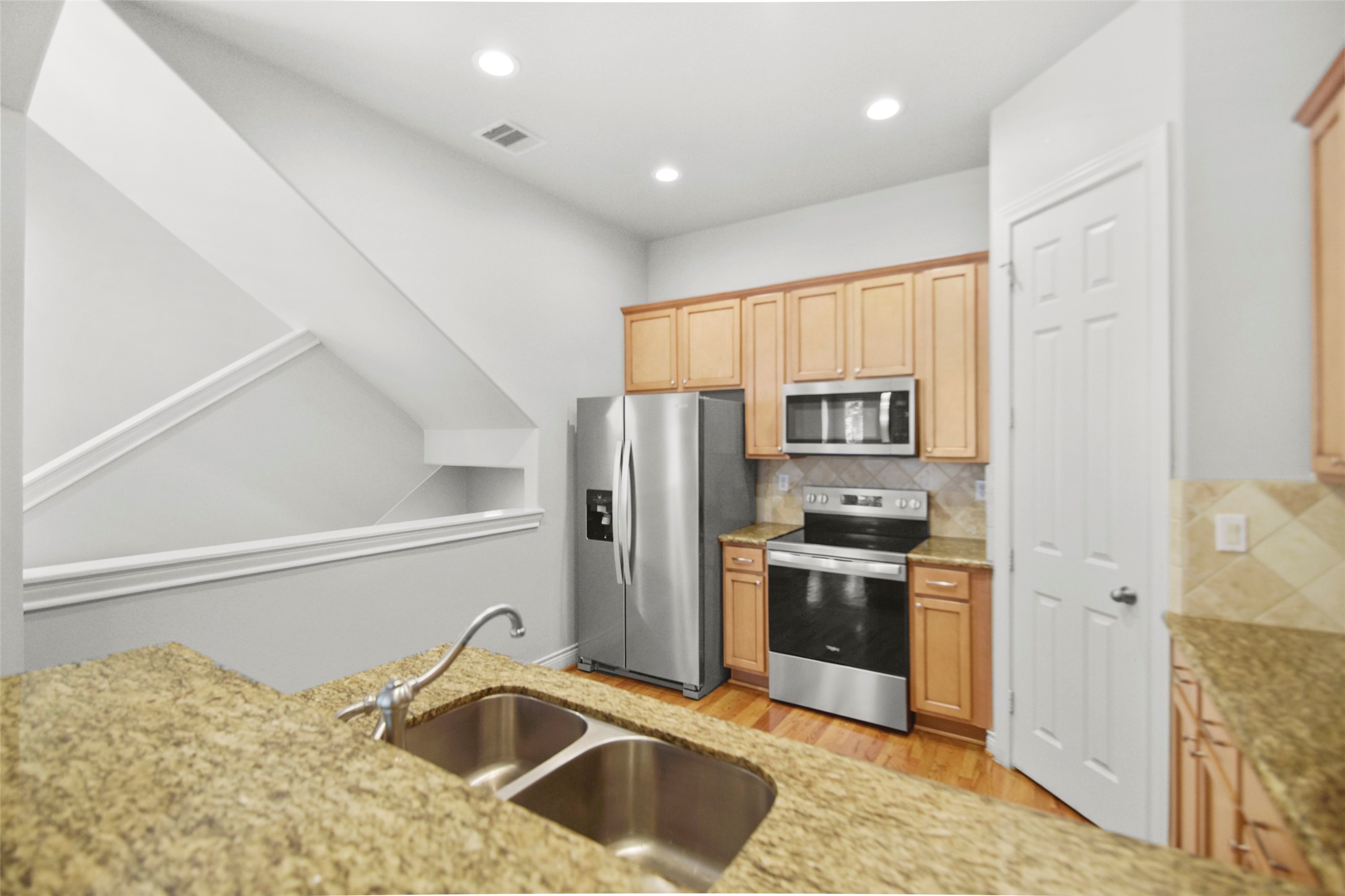 1602 Colorado Street Houston, TX 77007 - Photo 7 of 29 a kitchen with stainless steel appliances granite countertop a refrigerator sink and stove