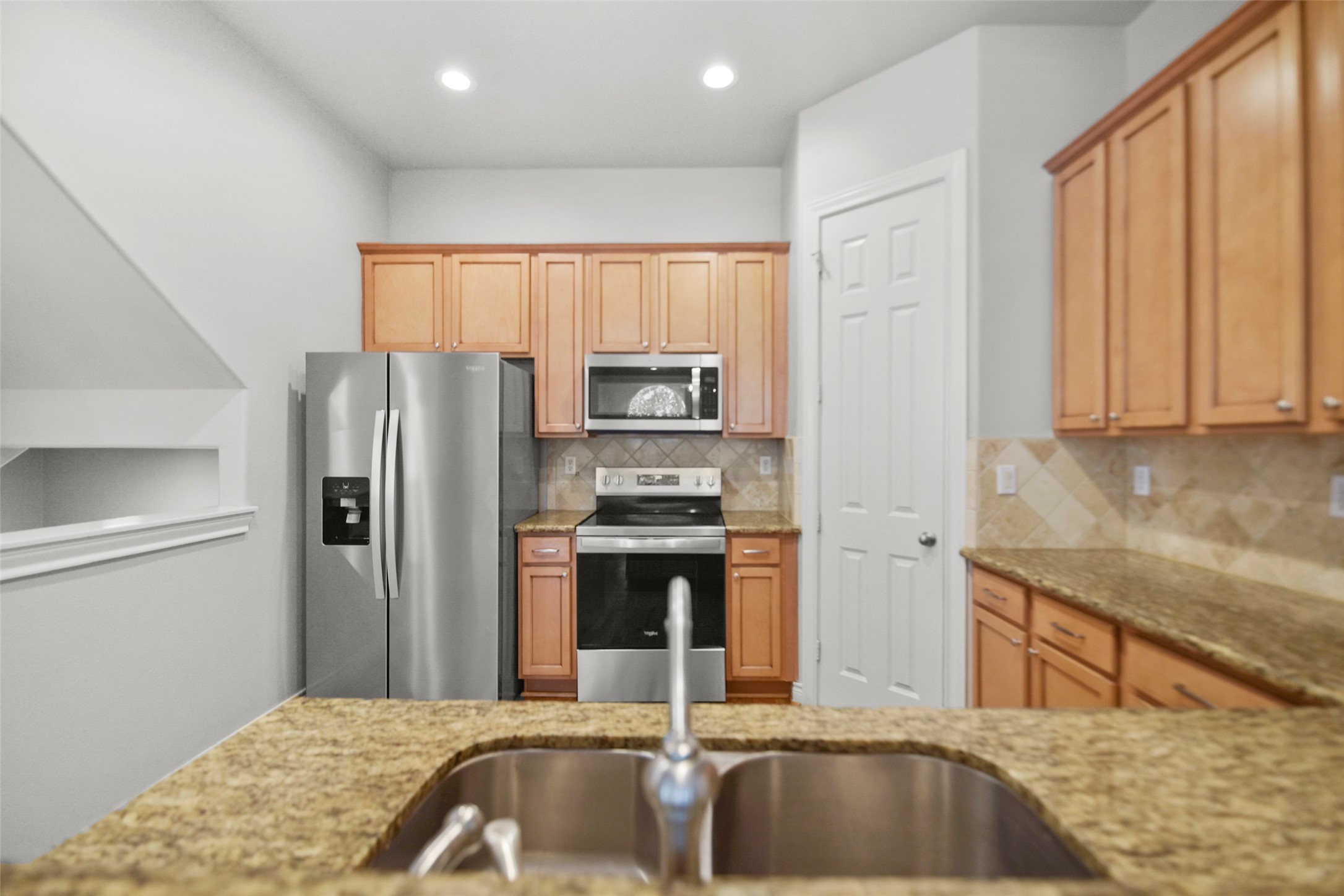 1602 Colorado Street Houston, TX 77007 - Photo 8 of 29 a kitchen with a refrigerator sink and stove
