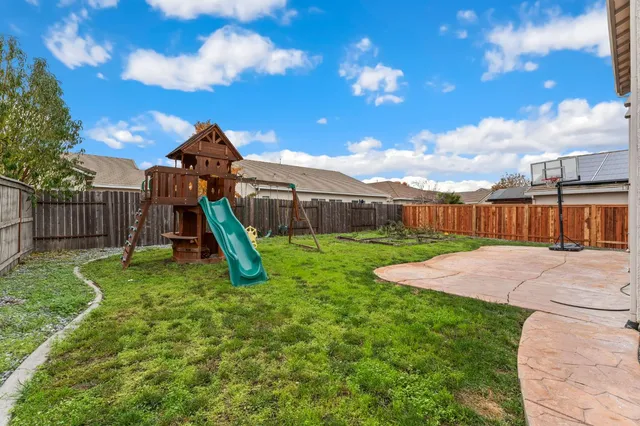 a view of a garden with a slide