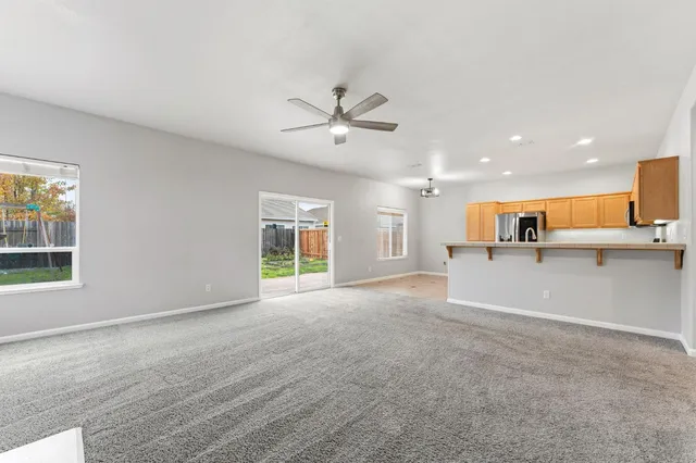 a view of a kitchen with a sink and a window