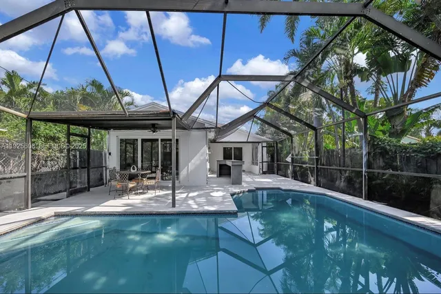 a view of a swimming pool with a patio