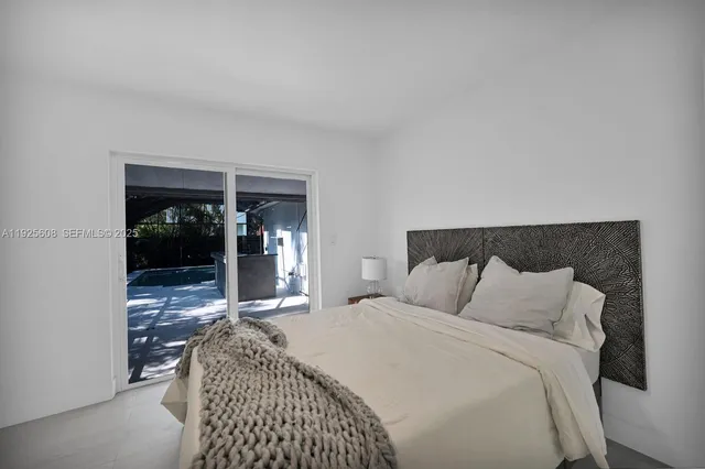 a bedroom with a bed and walk in closet