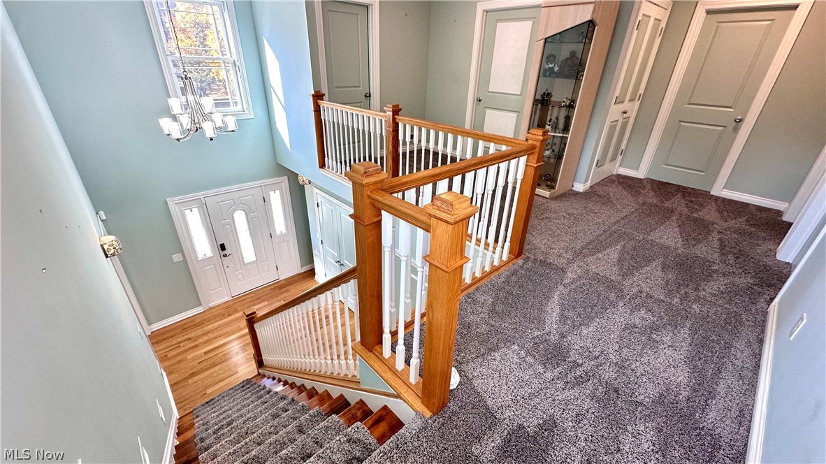 2603 Rockefeller Road Wickliffe, OH 44092 - Photo 15 of 34 Multi-level interior featuring a grand entryway, hardwood flooring, and a contemporary chandelier