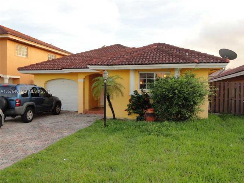 15636 Southwest 35th Terrace Miami, FL 33185 - Photo 1 of 18 a view of a house with a backyard and a car parked