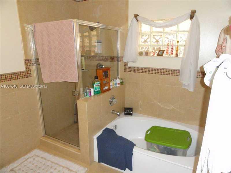 15636 Southwest 35th Terrace Miami, FL 33185 - Photo 15 of 18 a bathroom with a tub and shower