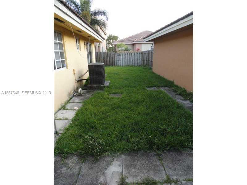 15636 Southwest 35th Terrace Miami, FL 33185 - Photo 18 of 18 a backyard of a house with lots of green space