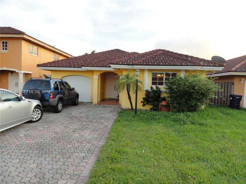 15636 Southwest 35th Terrace Miami, FL 33185 - Photo 2 of 18 a view of a house with a garden and pathway