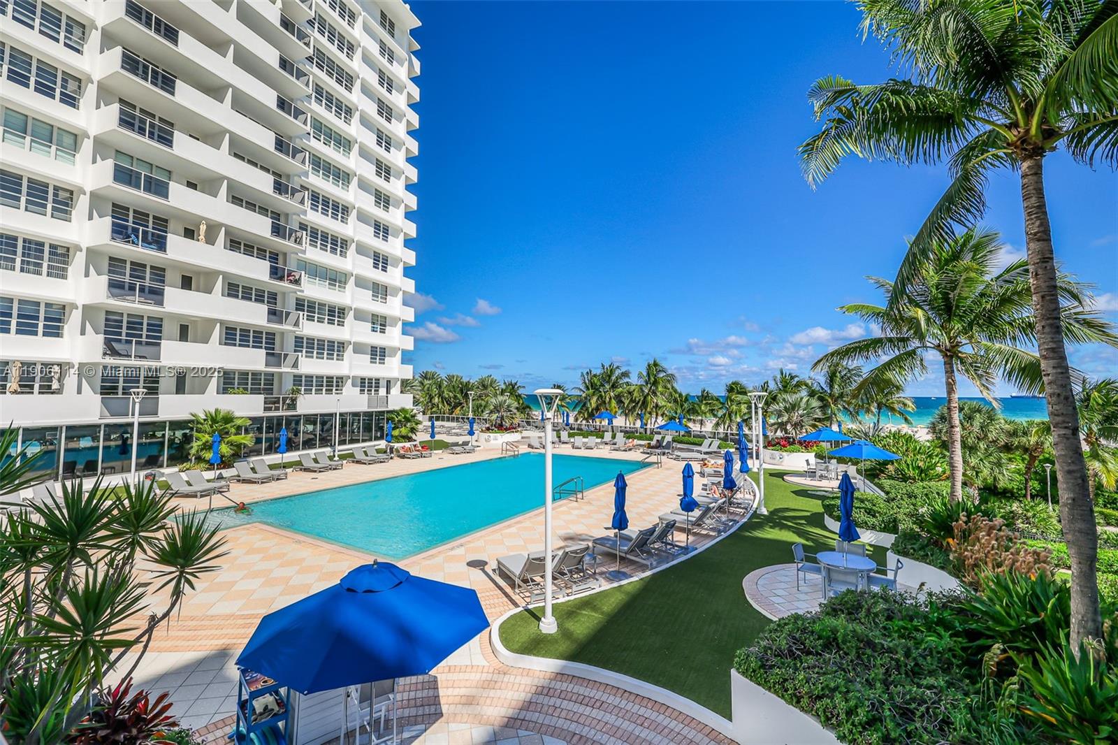 100 Lincoln Road, Unit 502 Miami Beach, FL 33139 - Photo 33 of 42 a view of a swimming pool with outdoor seating and plants