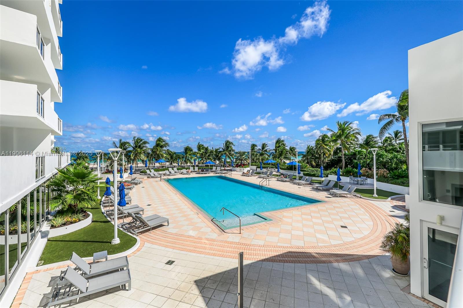 100 Lincoln Road, Unit 502 Miami Beach, FL 33139 - Photo 36 of 42 a view of a swimming pool with a patio