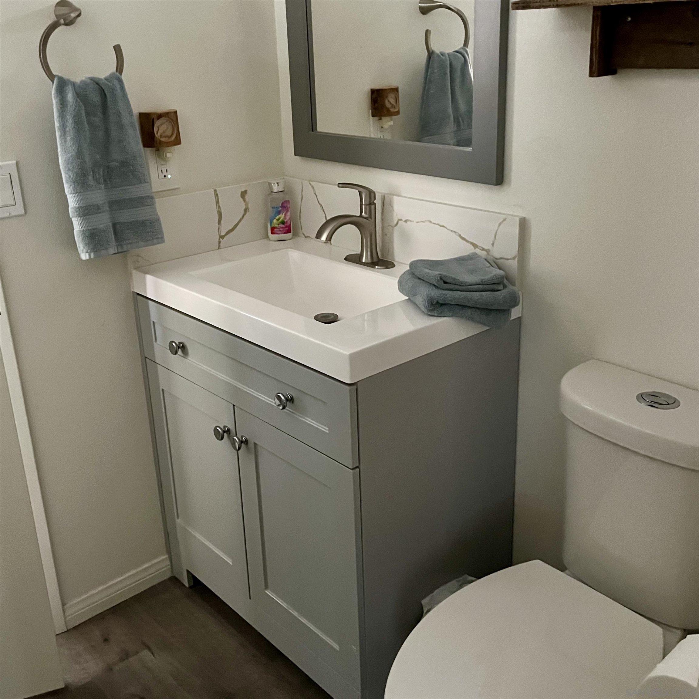 35109 Highway 79, Unit SPACE/ Warner Springs, CA 92086 - Photo 11 of 54 a bathroom with a sink toilet and mirror