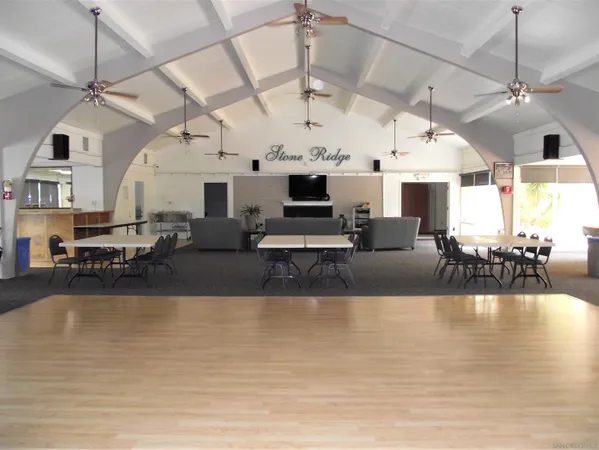 a view of a living room and kitchen