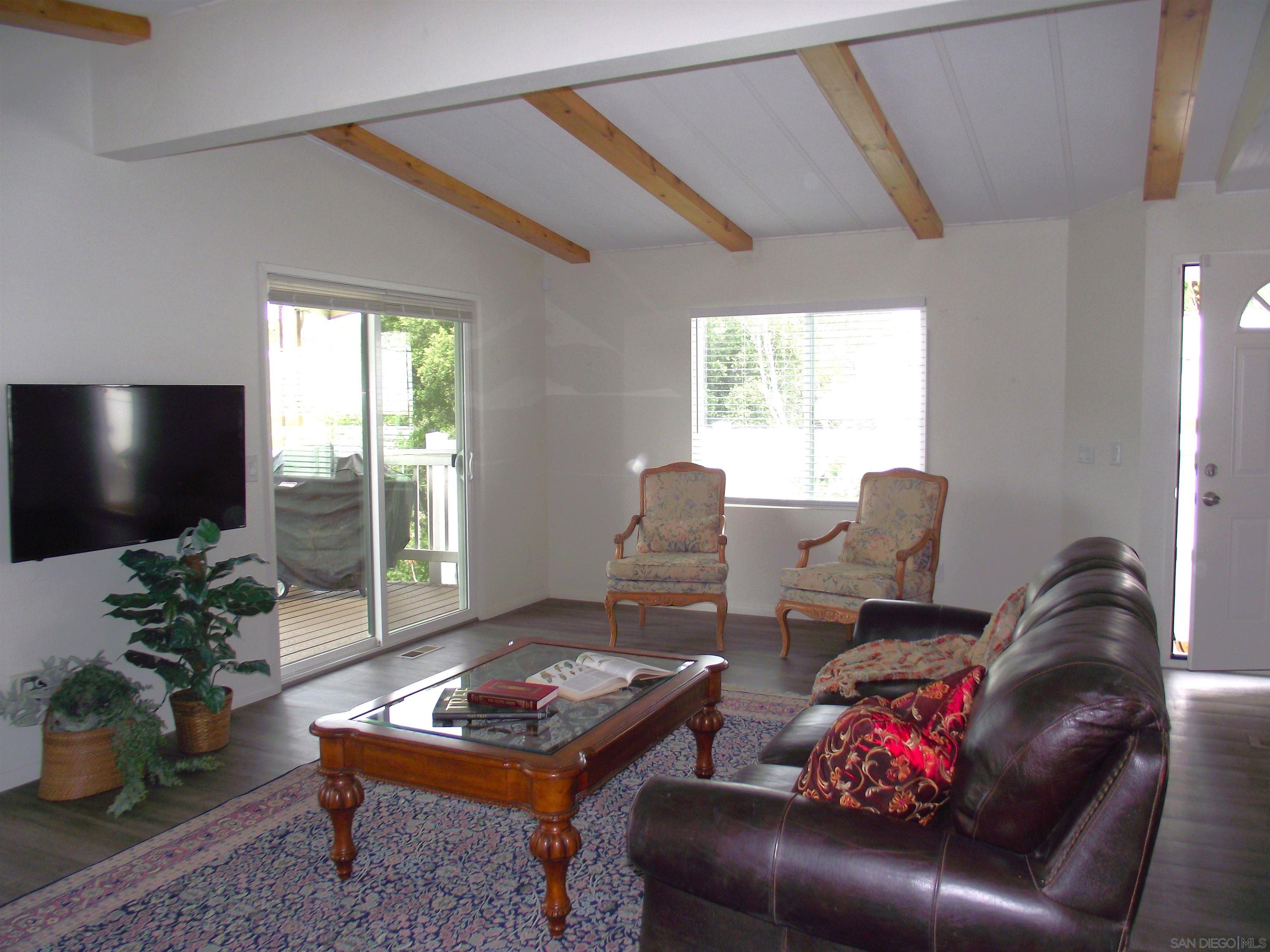 35109 Highway 79, Unit SPACE/ Warner Springs, CA 92086 - Photo 41 of 54 a living room with furniture and a flat screen tv