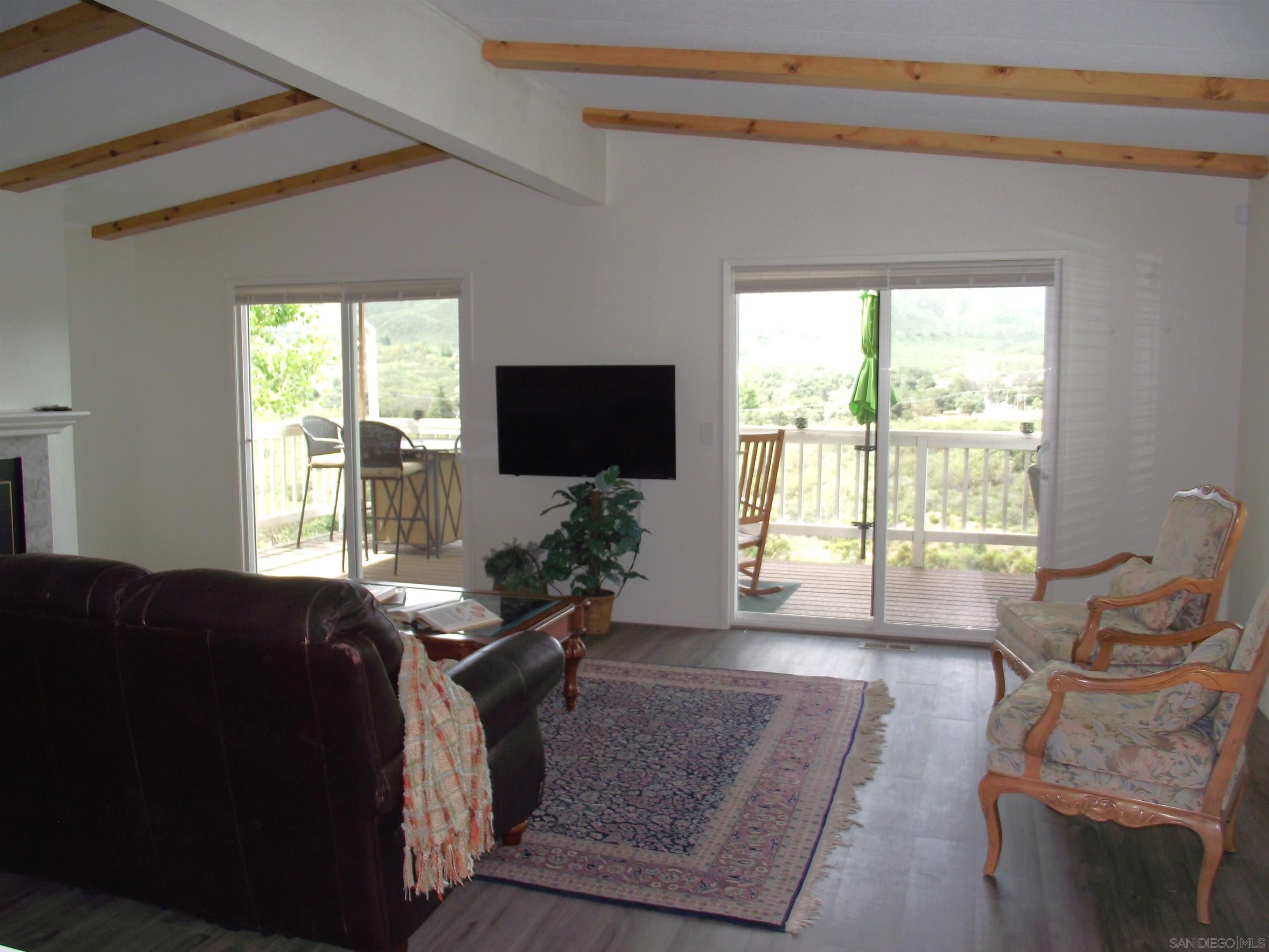 35109 Highway 79, Unit SPACE/ Warner Springs, CA 92086 - Photo 42 of 54 a living room with furniture and a flat screen tv