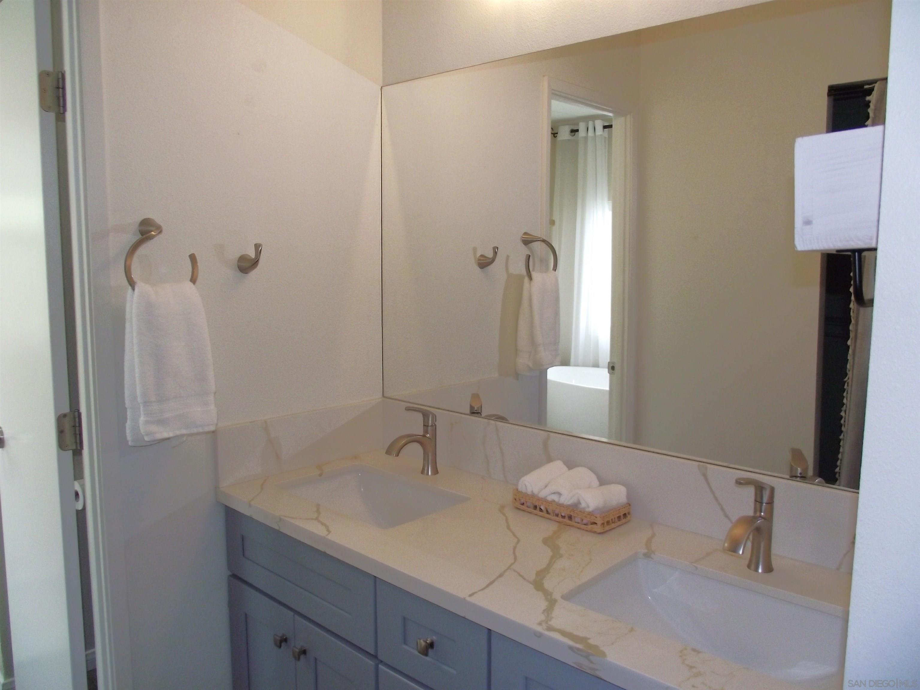 35109 Highway 79, Unit SPACE/ Warner Springs, CA 92086 - Photo 49 of 54 a bathroom with a granite countertop sink and a mirror