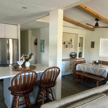 a view of a dining room with furniture and window