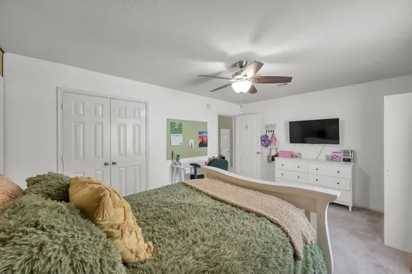 a bed room with furniture and a window