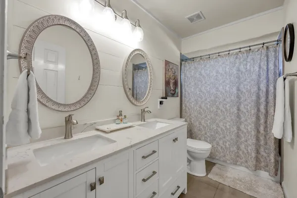 a bedroom with a bed and a fireplace